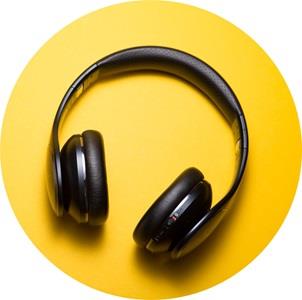 yellow background with black headphones